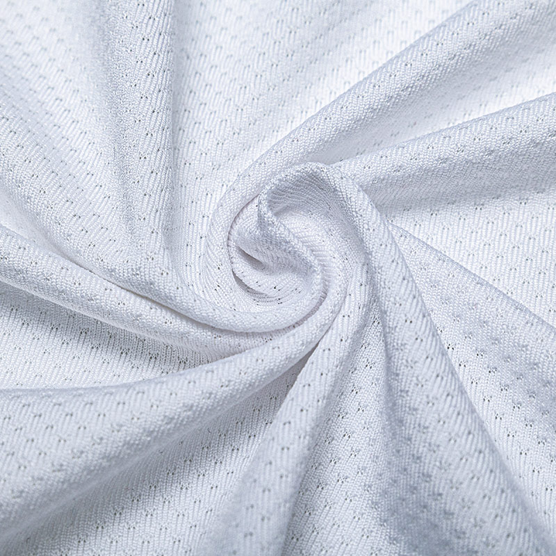 92 % Poly, 8 % Spandex, Schmetterlingsnetz. Sportlich, schnell trocknend
